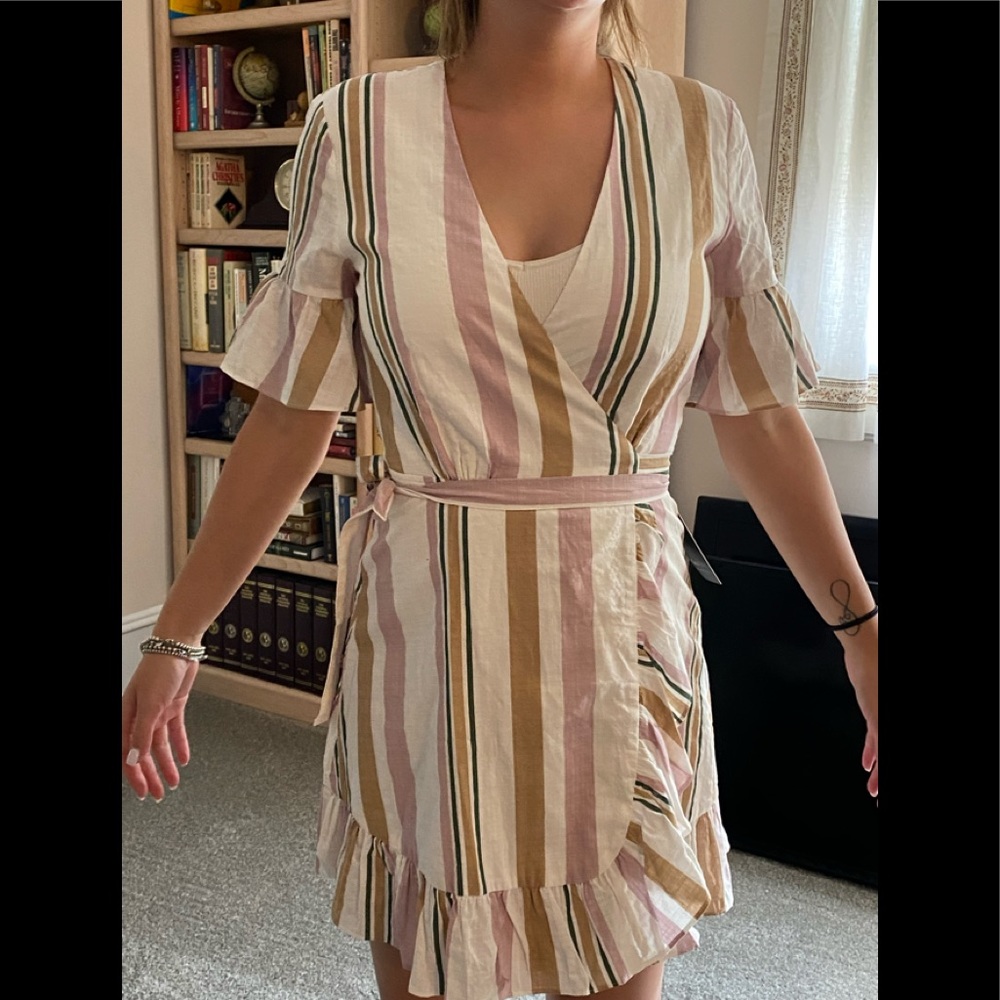 Wrap dress. White base with stripes. Never worn
